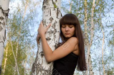 girl hugging birch 2