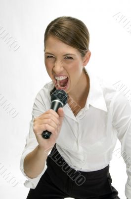 businesswoman singing into microphone