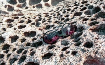 Sun glasses on the honeycomb stone surface