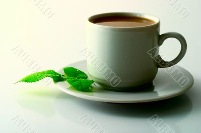 Cup of cofee with leaves