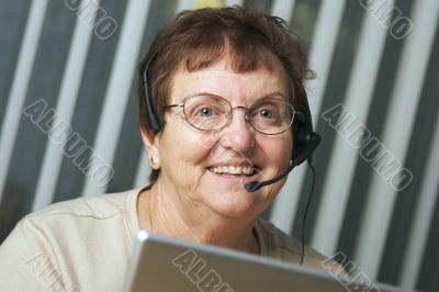Smiling Senior Adult with Telephone Headset