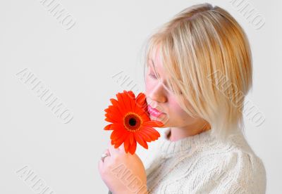Blond Woman with a Bright Orange Flower