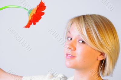 Blond Woman with a Bright Orange Flower