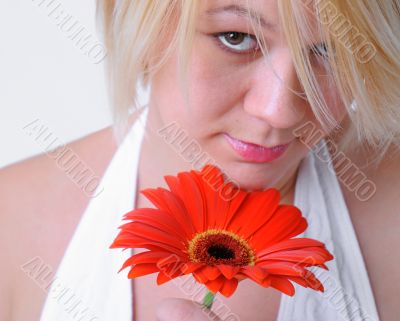 Blond Woman with a Bright Orange Flower