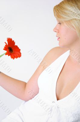 Blond Woman with a Bright Orange Flower