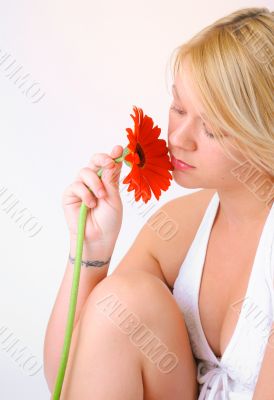 Blond Woman with a Bright Orange Flower
