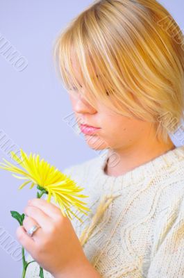 Blond Woman with a Bright Yellow Flower