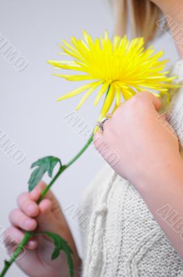 Blond Woman with a Bright Yellow Flower