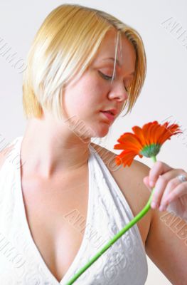 Blond Woman with a Bright Orange Flower