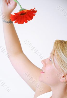 Blond Woman with a Bright Orange Flower