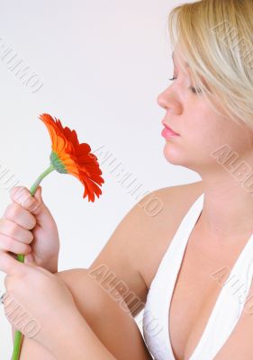 Blond Woman with a Bright Orange Flower