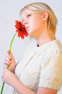 Blond Woman with a Bright Orange Flower