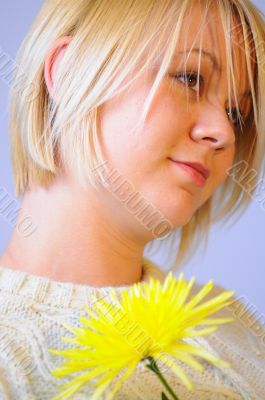 Blond Woman with a Bright Yellow Flower