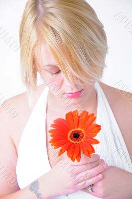 Blond Woman with a Bright Orange Flower