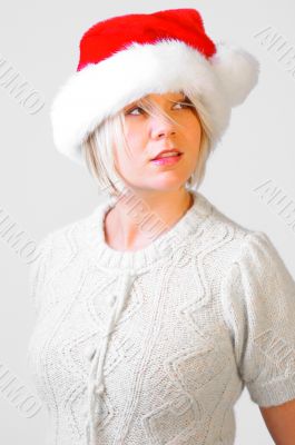 Blonde Woman with a Santa`s Hat