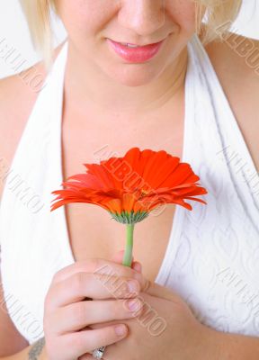 Blond Woman with a Bright Orange Flower