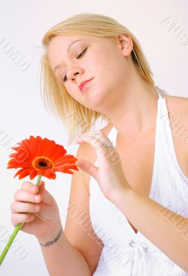 Blond woman with an Orange Flower