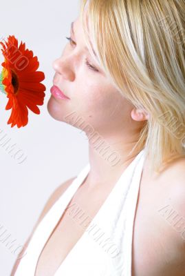 Blond woman with an Orange Flower