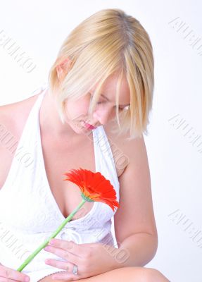 Blond woman with an Orange Flower