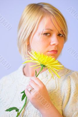 Blond Woman with a Bright Yellow Flower