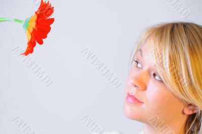 Blond woman with an Orange Flower