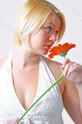 Blond woman with an Orange Flower