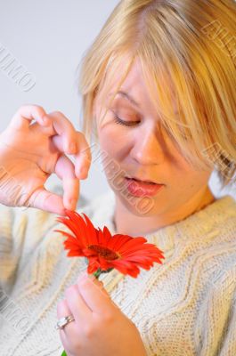 Blond woman with an Orange Flower