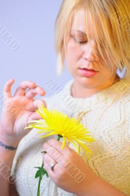 Blonde Woman with a Bright Yellow Flower