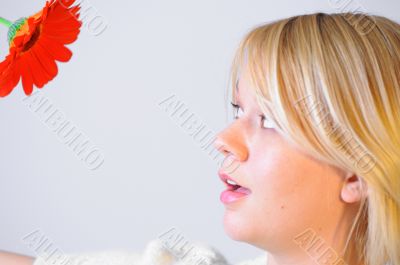 Blond woman with an Orange Flower