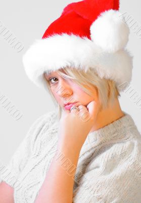 Blonde Woman with a Santa`s Hat