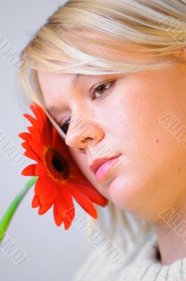 Blond woman with an Orange Flower