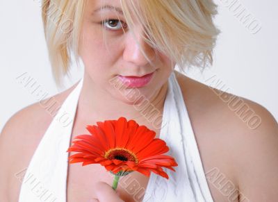 Blond woman with an Orange Flower