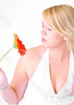 Blond woman with an Orange Flower
