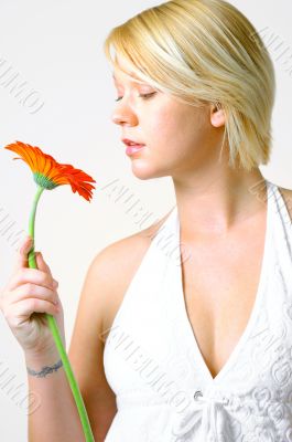Blond woman with an Orange Flower
