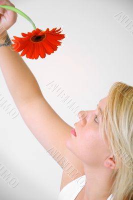Blond Woman with a Red Flower