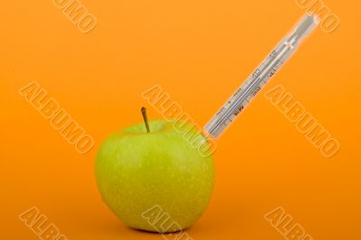 Apple with thermometer
