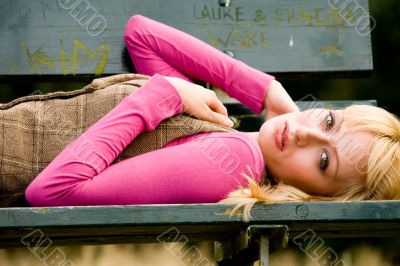 On my back on a bench