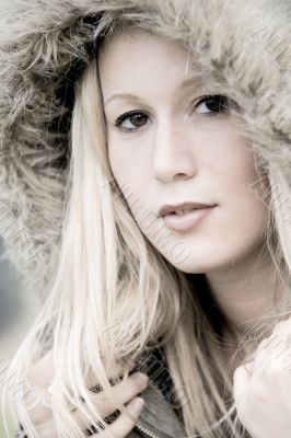 Sexy blond girl with a cap