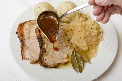 Roast port with pickled cabbage and dumpling