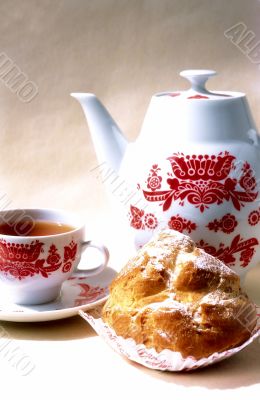Biscuit, cup of coffee and coffee-pot