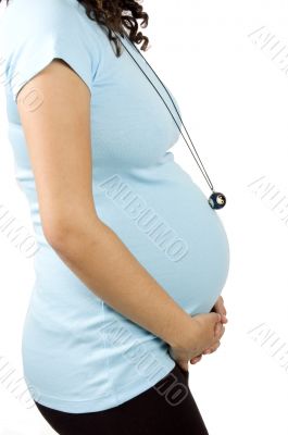 30 weeks pregnant teenager holding her belly