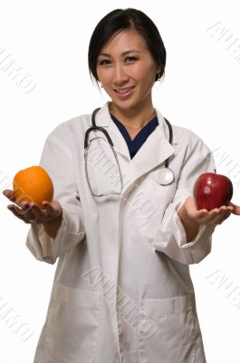 Doctor with apple and orange