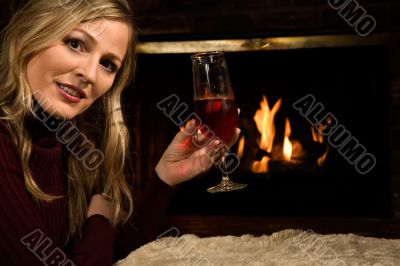 Drinking wine by the fire
