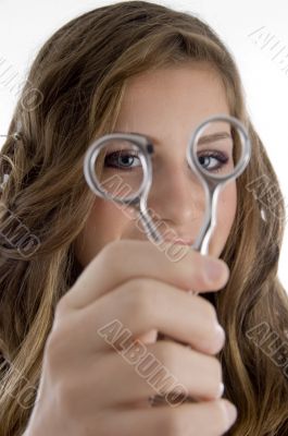 girl looking into scissors