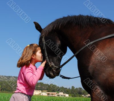 girl kissing her horse