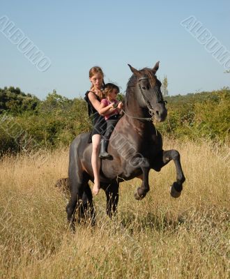 rearing stallion, teen and child
