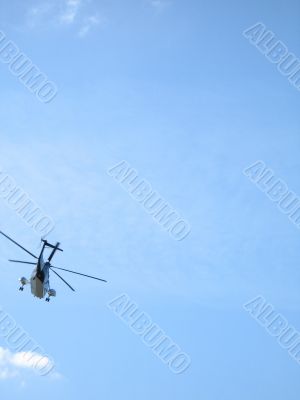 helicopter in the blue sky