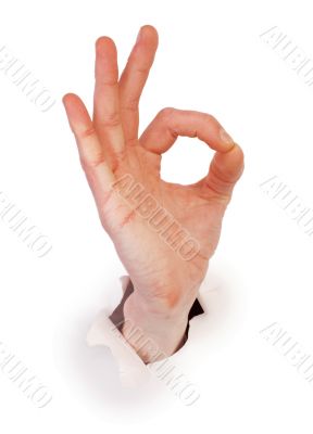 Gesture male hand through white paper