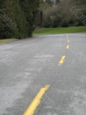 old paved path with split yellow line