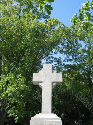 stone cross with blue sky